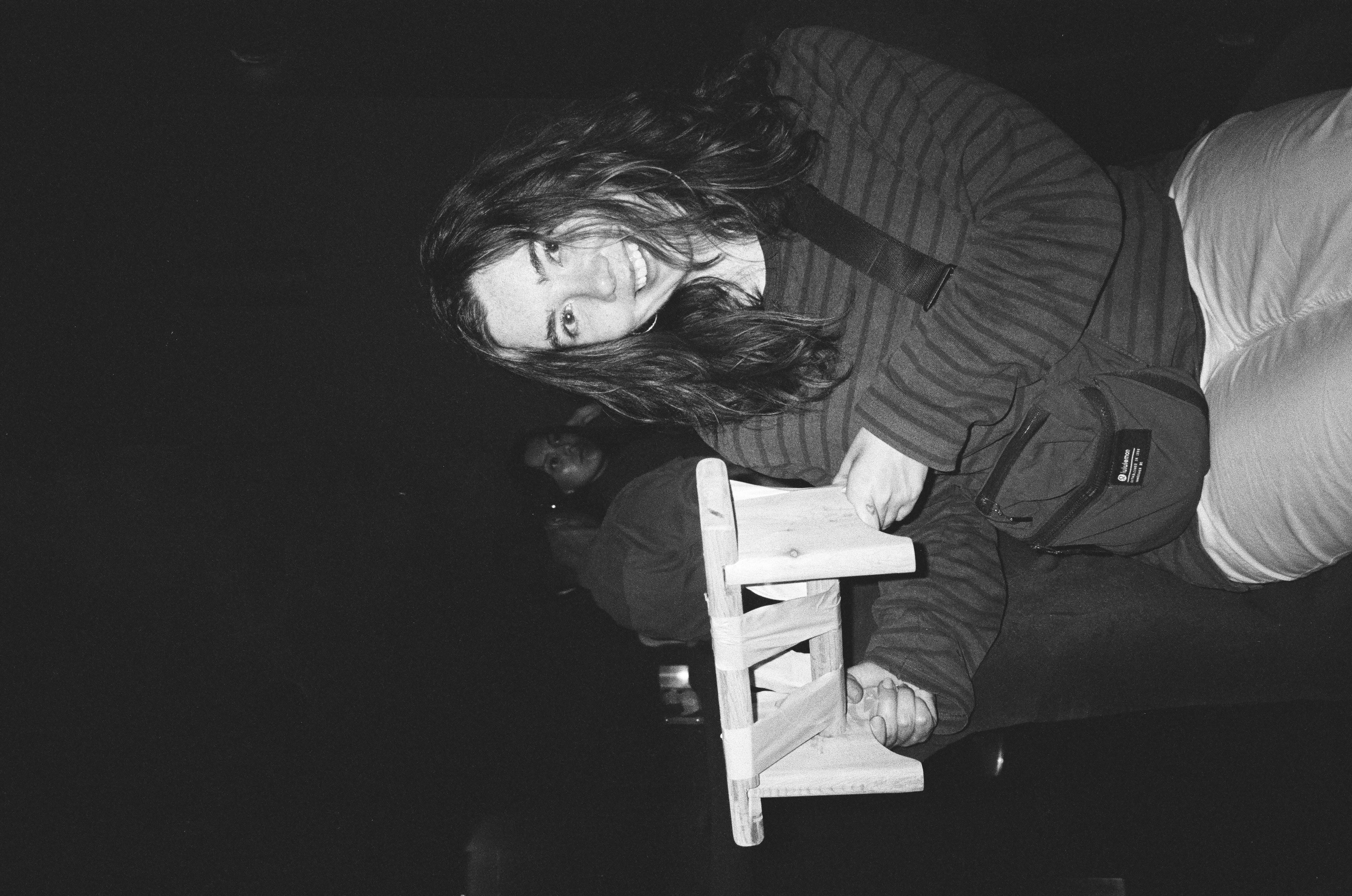 Ella Krings holding a small handmade stool